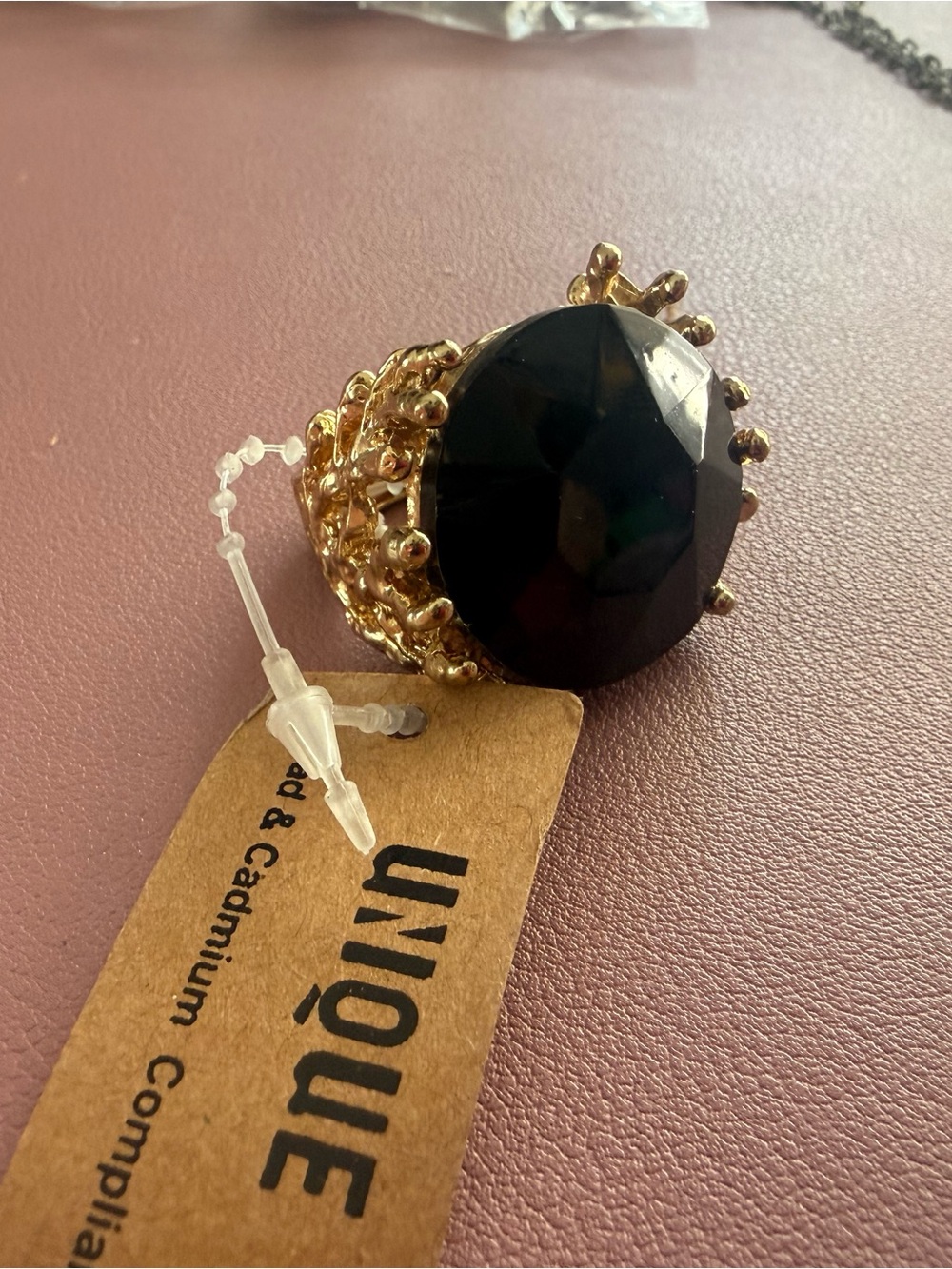 Unique Gold-Tone Statement Ring with Large Black Gem